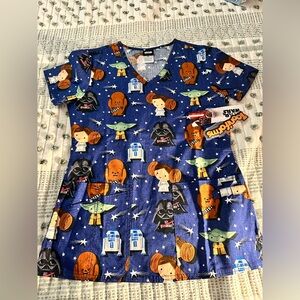 Star Wars scrub top with tags on. Super cute design with pockets. Soft material.